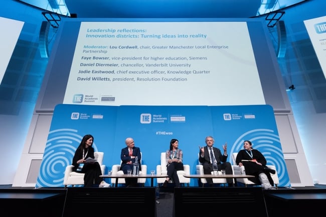 Panelists discussing at a leadership conference