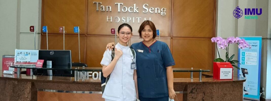 Two nurses smiling at Tan Tock Seng Hospital reception